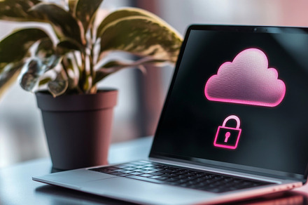Laptop displaying cloud security interface on screen with green