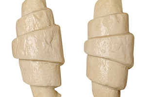 Raw croissant blanks on isolated background, top view, a Food & Drink Photo by ndanko
