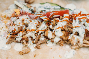 Chicken shawarma doner kebab meat sauce fast food, a Food & Drink Photo by Photo Drive Studio