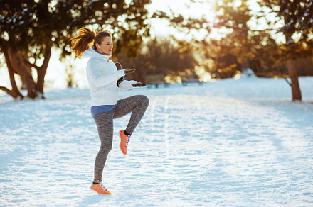 Full length portrait of fit woman in white jacket training, a Person Photo by Alliance Images