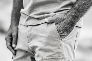Man in cargo pants with hands in pockets, a Beauty & Fashion Photo by AlyaAnd