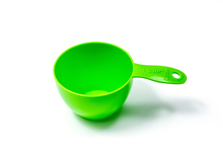 Green ingredient measuring cup, a Background Photo by wr7 Media