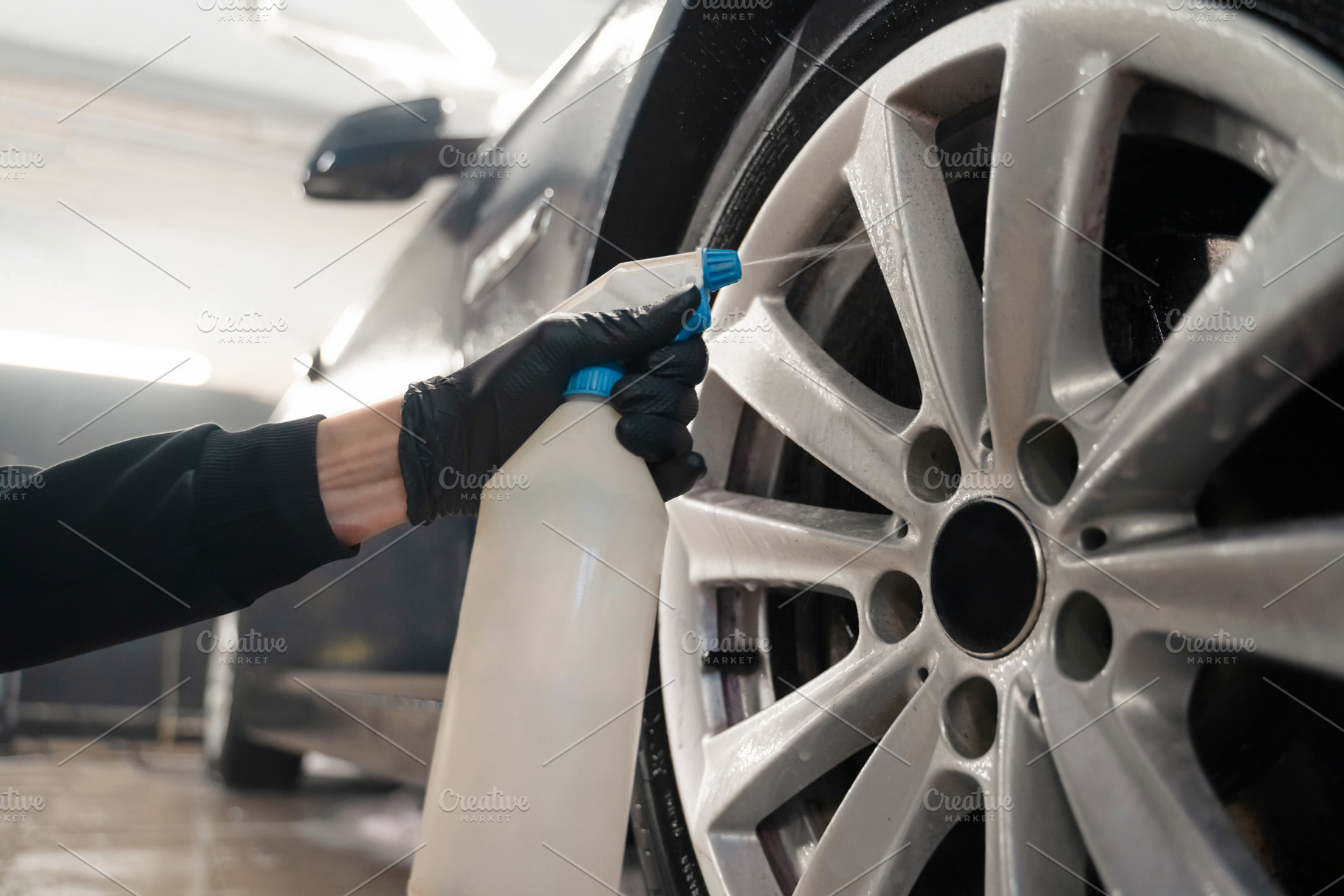 Auto detailing worker applies chemis, a Photo by Andrii Borodai