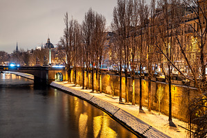 Snowy Seine River embankment at