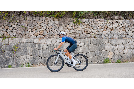 Panoramic side view of a cyclist on, a Sports & Recreation Photo by Xavi Bosch Stock