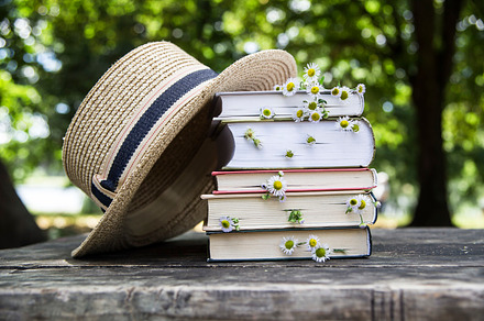 Books with wild flowers and hat stock photo containing summer and book, an Arts & Entertainment Photo by Valeriia • Svitlini