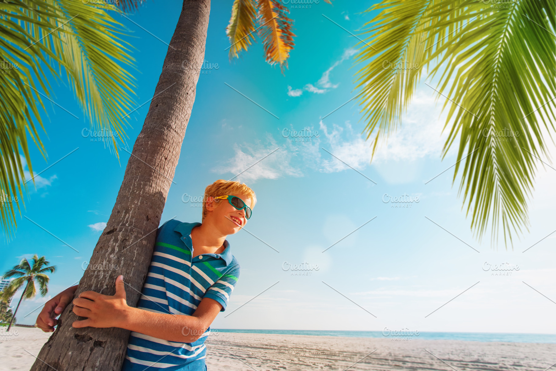 young boy on tropical beach, a Person Photo by Nadezhda_Prokudina
