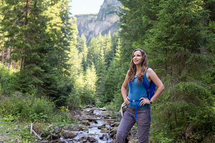 Slim tourist woman standing on a big boulder against scenery mountain landscape, a Sports & Recreation Photo by serkum