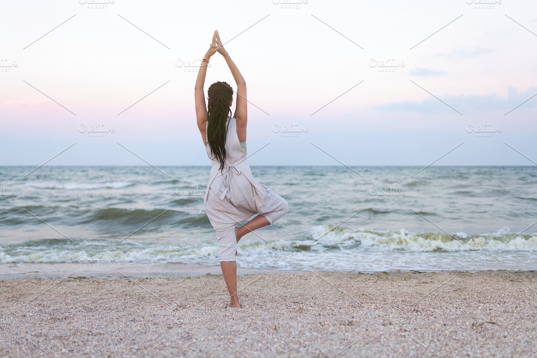 Yoga meditation woman meditating at beach sunset relaxing in yoga ...