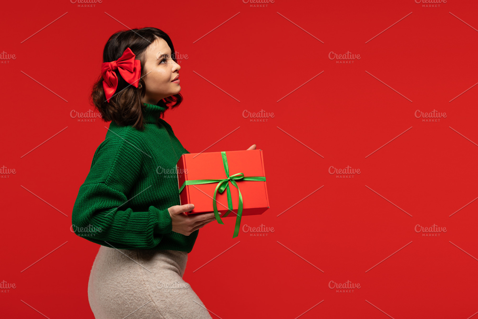 Woman with red bow in hair, a Holiday Photo by Elena Vagengeim