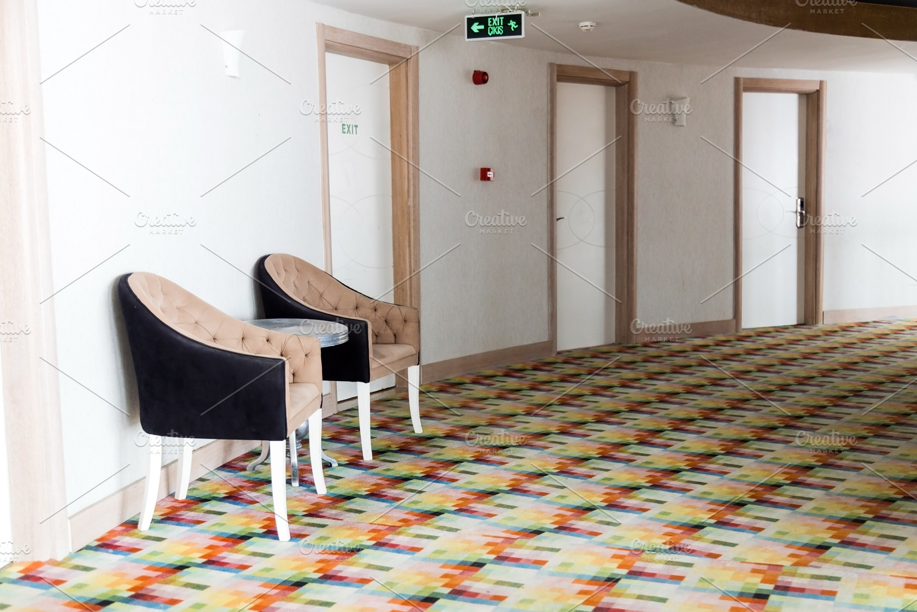 Art Nouveau armchairs stand between rooms in the corridor of a T, an Architecture Photo by TanaCh