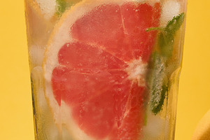 Top of clear glass with cold drink, grapefruit slices, ice and m, a Food & Drink Photo by ndanko