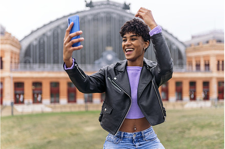 Afro Girl Taking Selfie with Phone