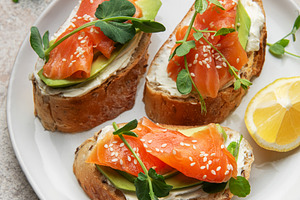 Salmon avocado bruschetta with cream cheese and microgreens, a Food & Drink Photo by Olena Rudo