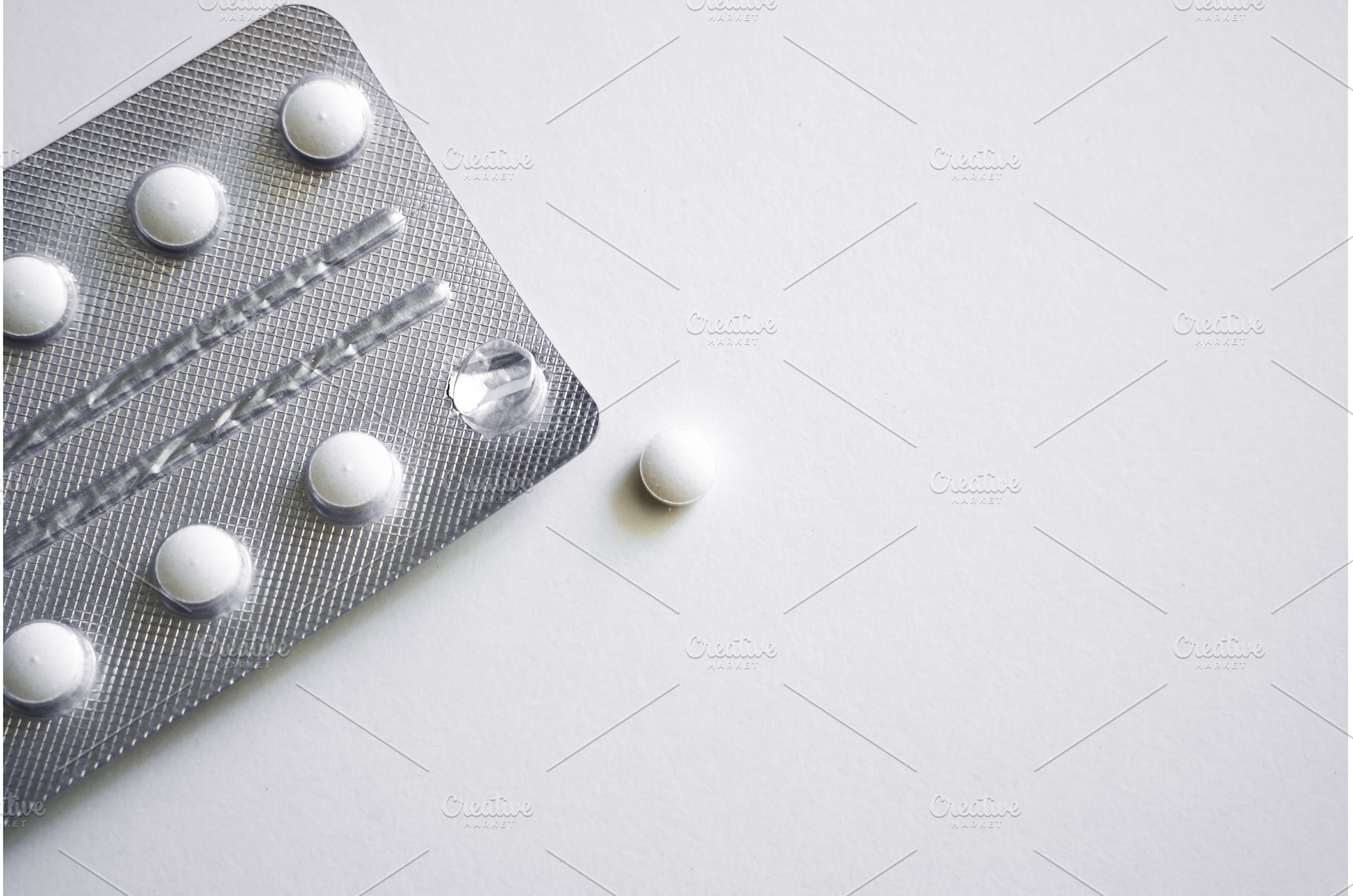 Single tablet near silver blister, a Health & Medical Photo by volodymyrshtun13795