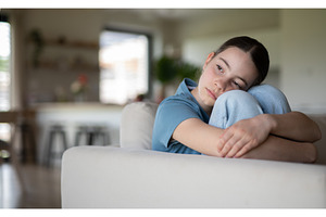 Teenage girl struggling with, a Person Photo by HalfPoint