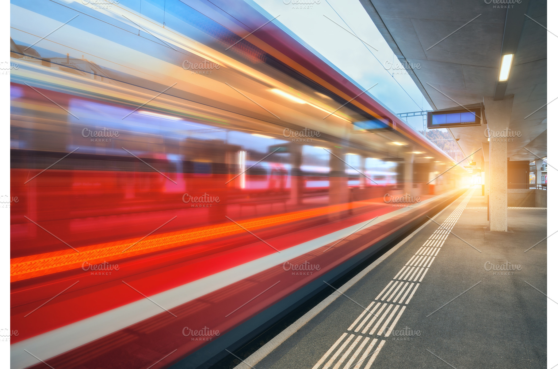 Blurred red passenger train passing, a Transportation Photo by den-belitsky