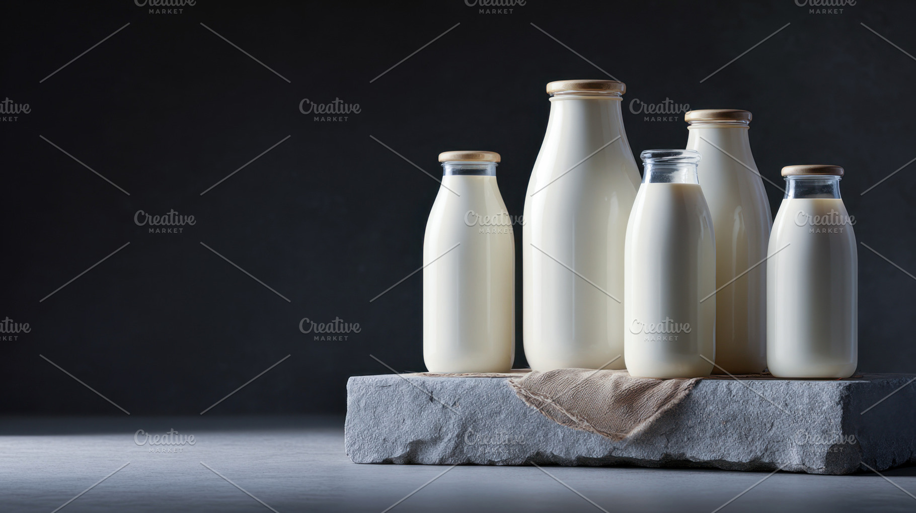 Milk bottles on a stone surface, a Photo by Beautiful things