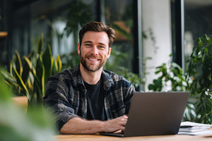 Man using laptop at office, a Photo by Beautiful things