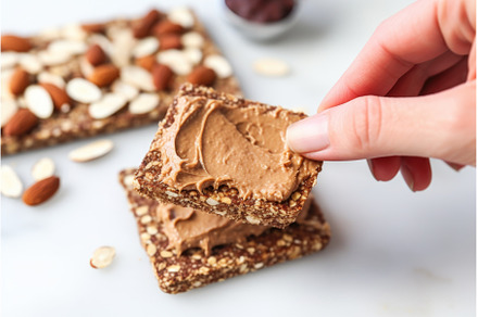 hand holding spatula to serve almond, a Food & Drink Photo by Sergey Kotenev