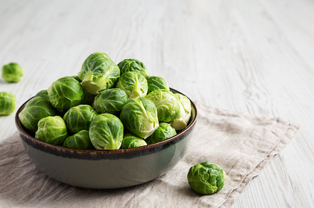 Raw Organic Brussel Sprouts in a Bowl, side view. Copy space., a Food & Drink Photo by LiudmylaChuhunova