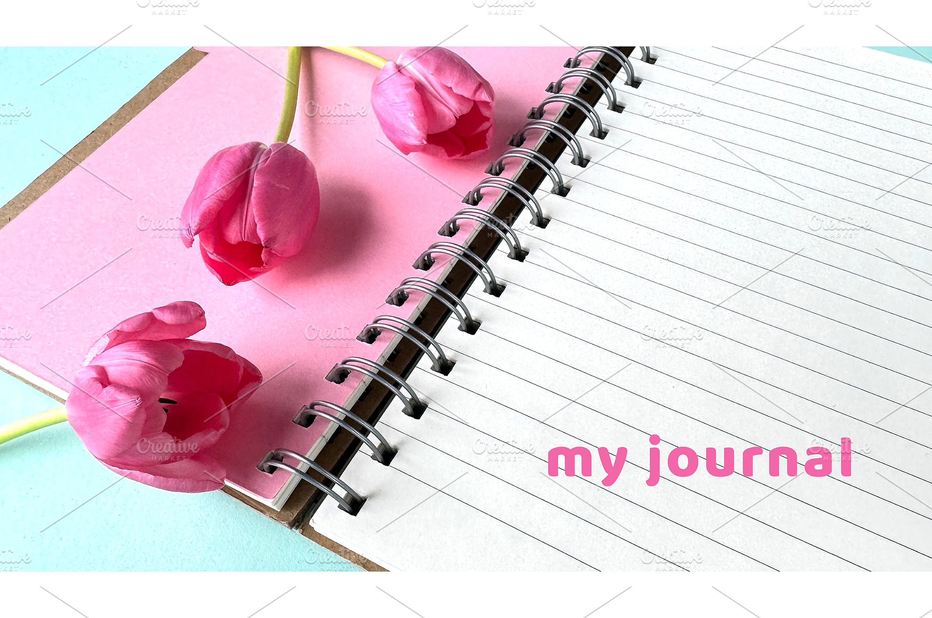 Open spiral notebook with pink, a Photo by tilialucida