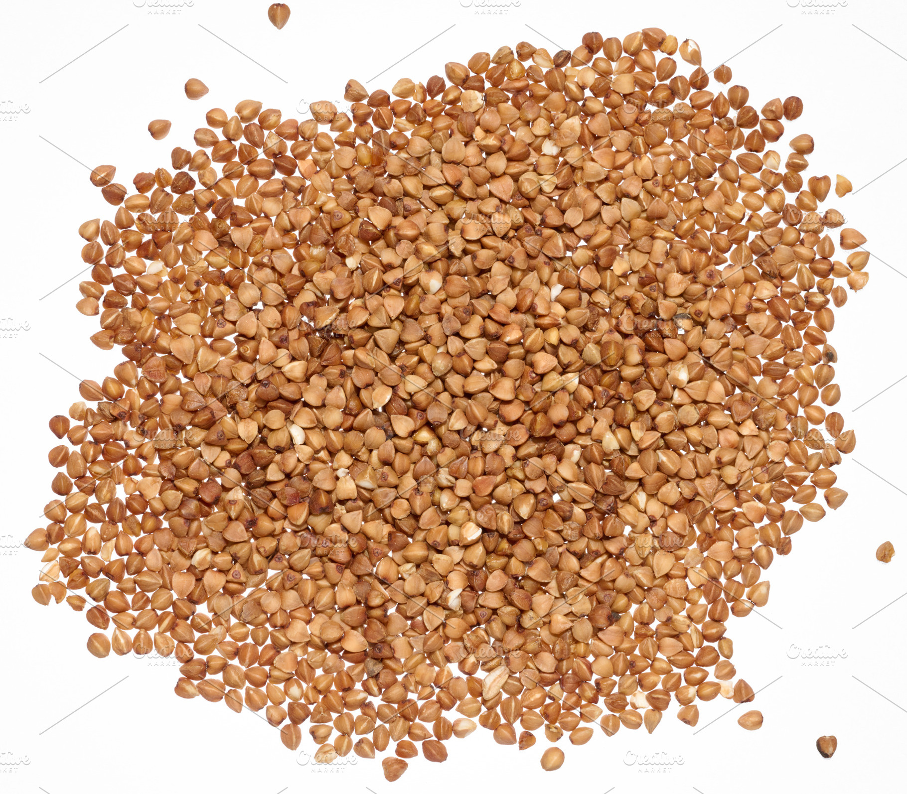 Raw buckwheat grains on isolated background, close up, a Food & Drink Photo by ndanko
