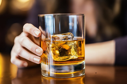 Alcoholic woman holding whiskey, a Person Photo by MistyDay