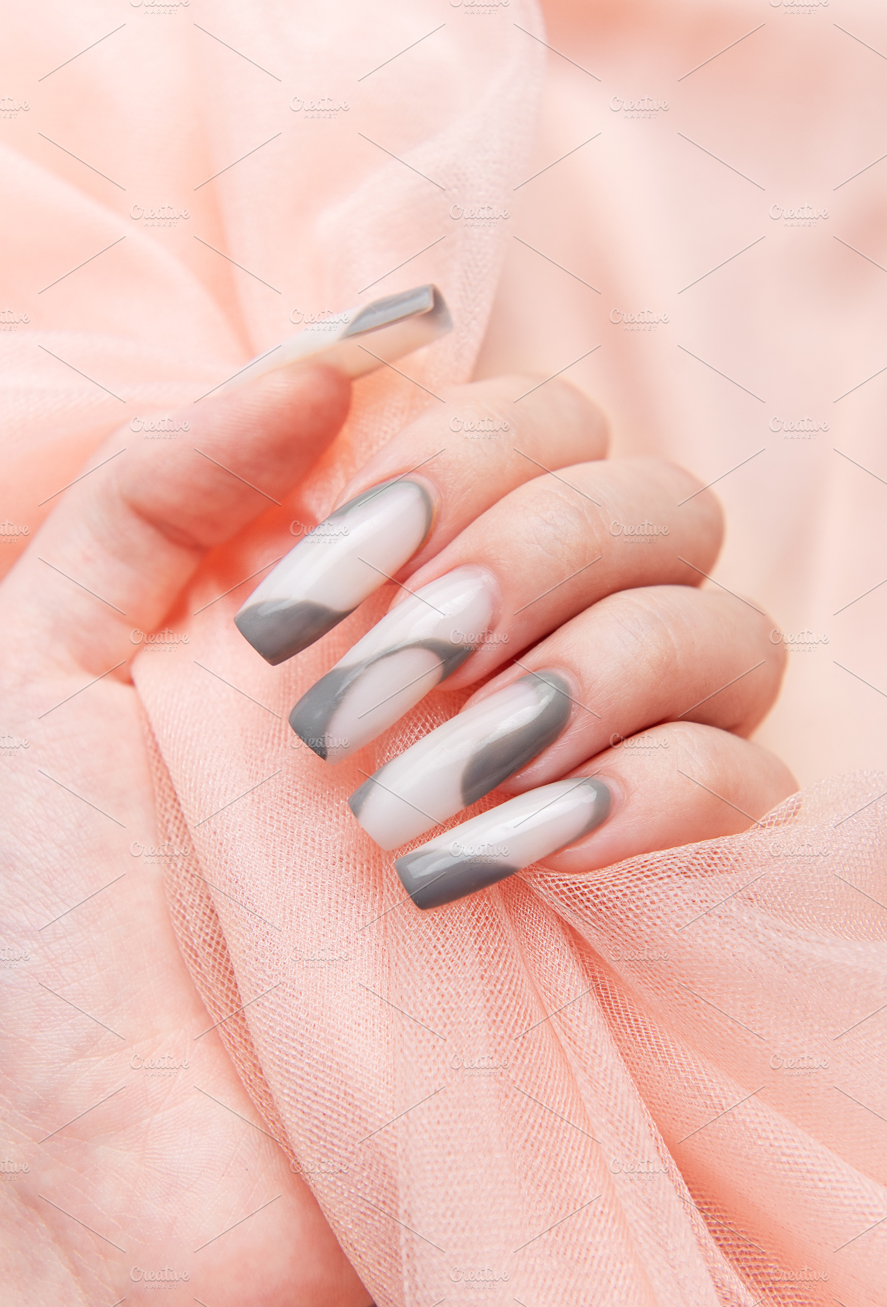 Woman's hand with long pink and gray nail art, a Beauty & Fashion Photo by Olena Rudo