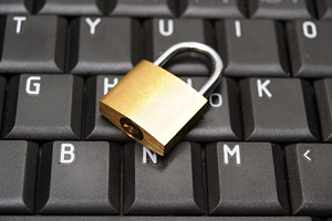 Padlock on laptop, a Photo by saiko3p
