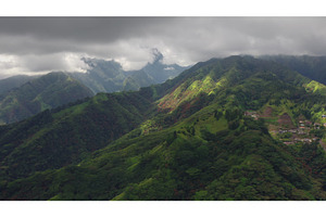 Dramatic clouds rolling over lush, a Nature Photo by Goinyk