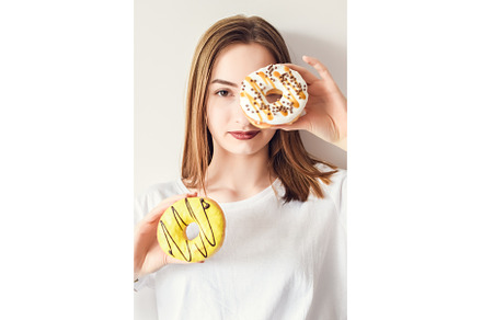 Beautiful girl holding donuts and, a Person Photo by NelliKovalchuk
