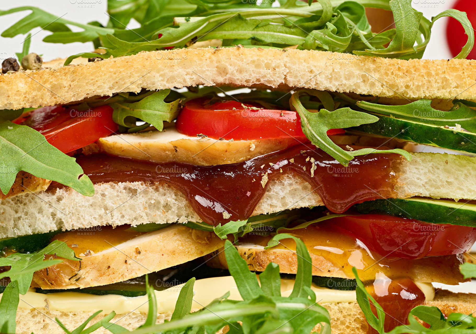 Sandwich with grilled chicken, fresh cucumber, tomato, arugula a, a Food & Drink Photo by ndanko