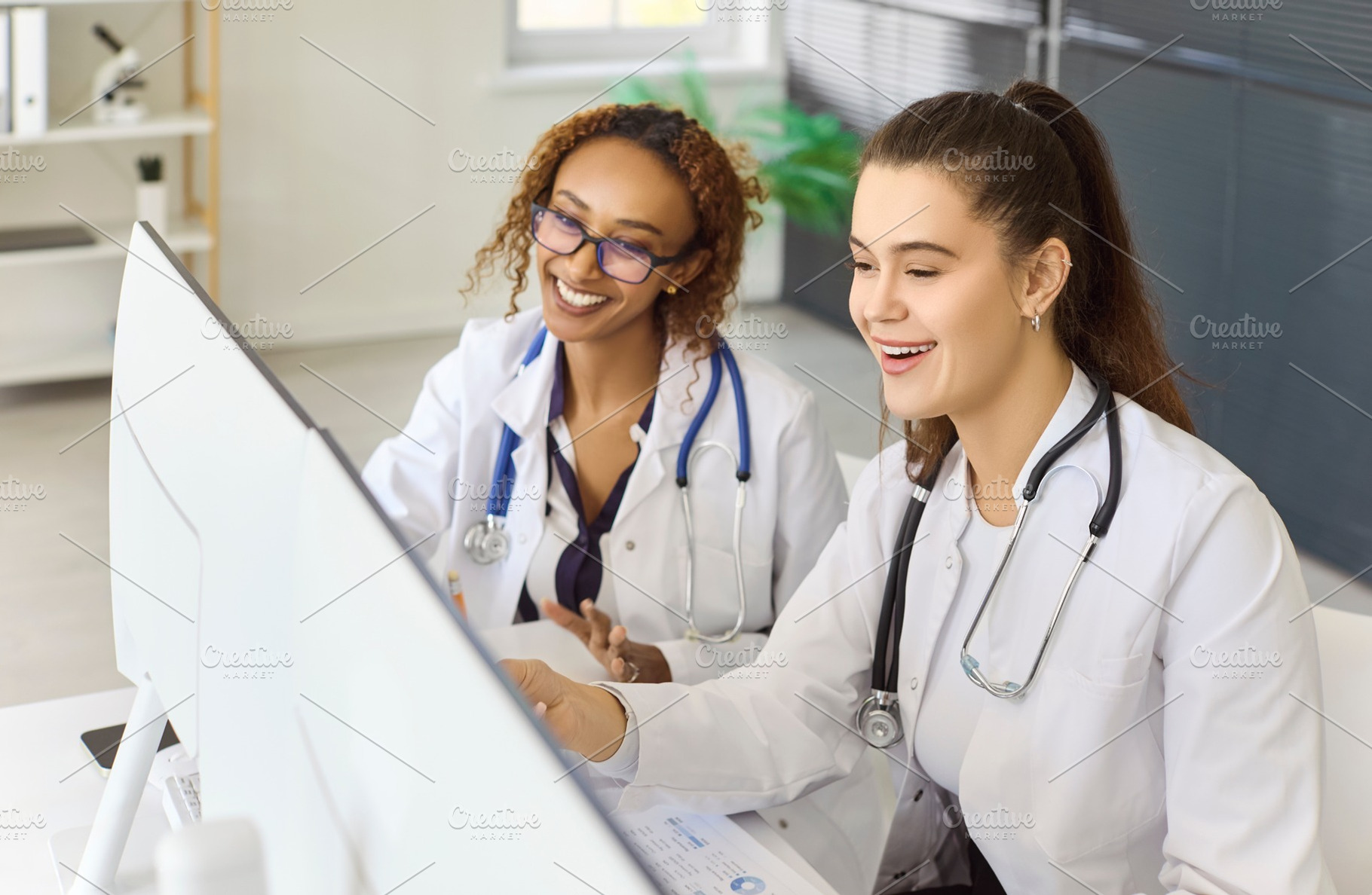Laughing Doctors Discussing Results, a Person Photo by StudioRomantic