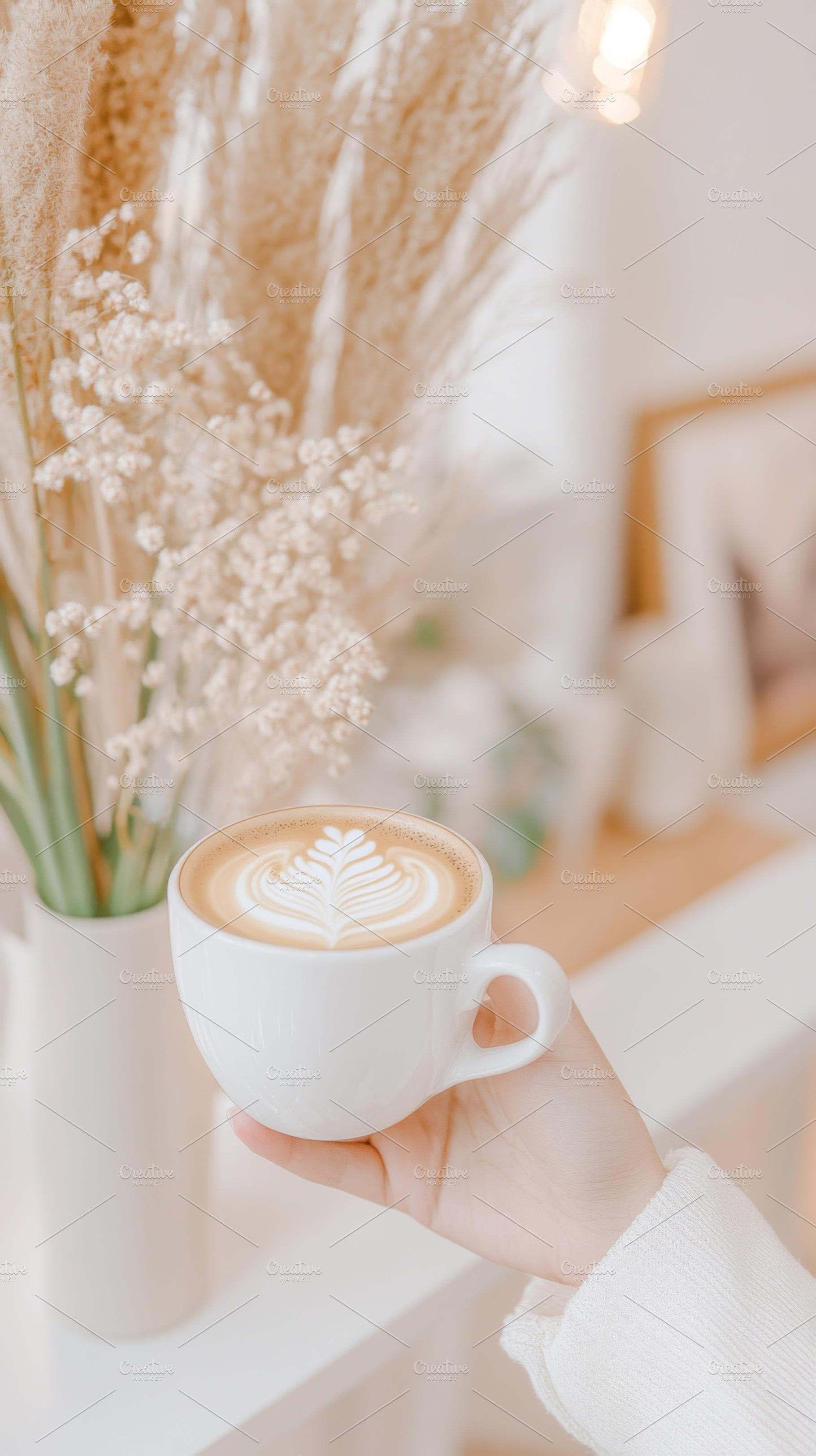 A woman holding cozy mug with latte, a Photo by Dvoevnore photos