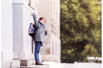 Portrait of schoolgirl in coat in, a School & Education Photo by HalfPoint