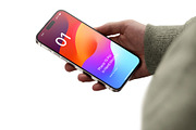 Phone 15 Pro Mockup in Hand, an iPhone Mockup by Asylab (Thumbnail 1 of 4)