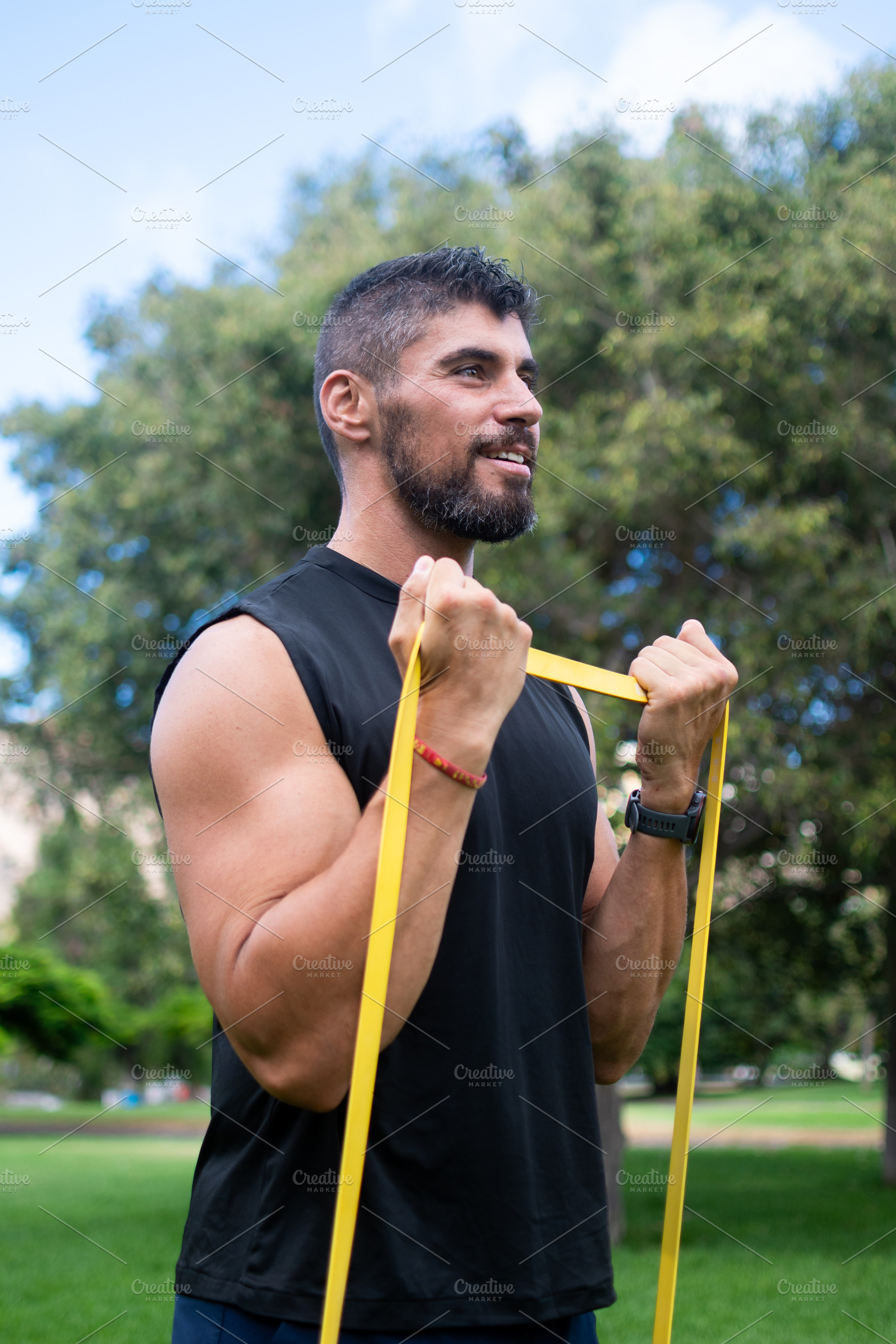 Man doing bicep curl with resistance band, a Sports & Recreation Photo by etorres69