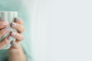 Woman's hands holding a cup of mint featuring mug, cup, and mint
