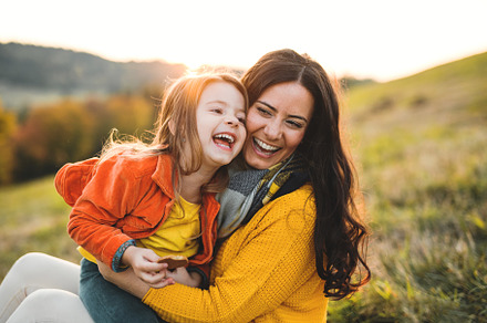 A portrait of young mother with a featuring family, beautiful, and woman, a Person Photo by HalfPoint