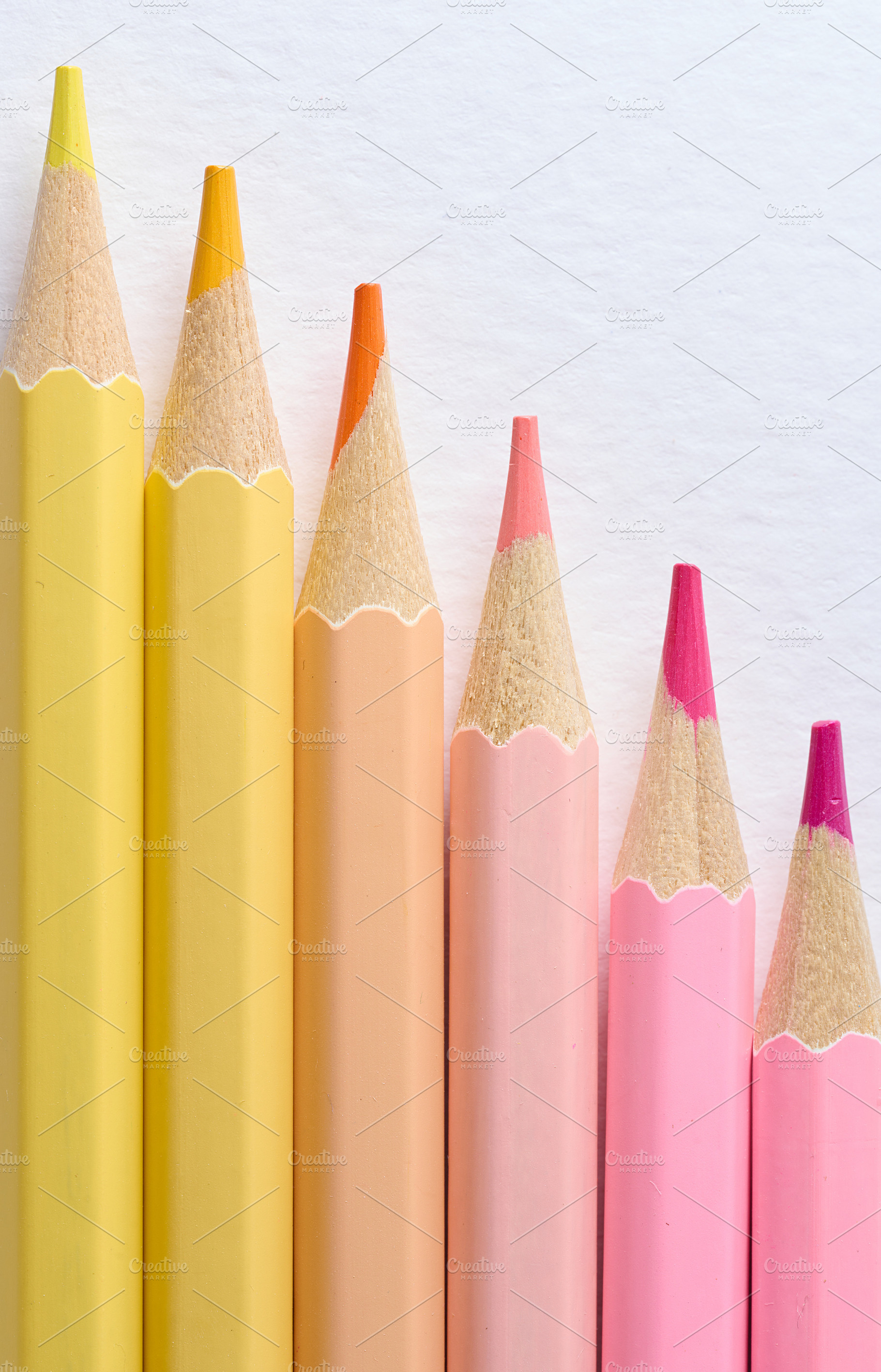 Close-up of six sharp-tipped colored pencils arranged horizontal, a School & Education Photo by ndanko