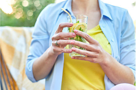 Woman drinking summer citrus, a Food & Drink Photo by IlliaBondarPhotography