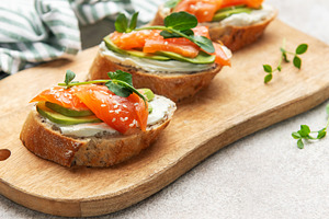 Smoked salmon toast with avocado and cream cheese, a Food & Drink Photo by Olena Rudo