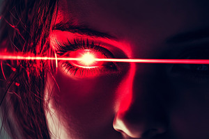 Female eye emitting red laser, a Person Photo by MistyDay