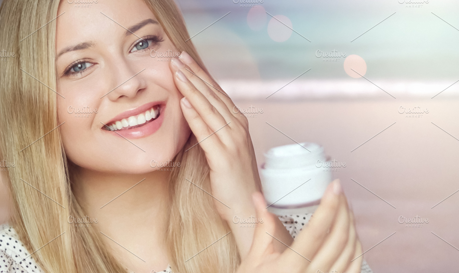 Young woman applying face cream, smiling, caring for skin, hydra, a Person Photo by Studio ANNA