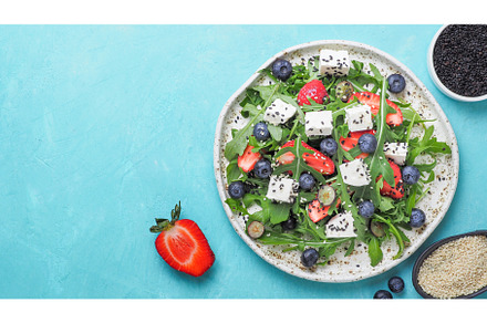 Salad with arugula, feta, strawberry, a Food & Drink Photo by Fascinadora