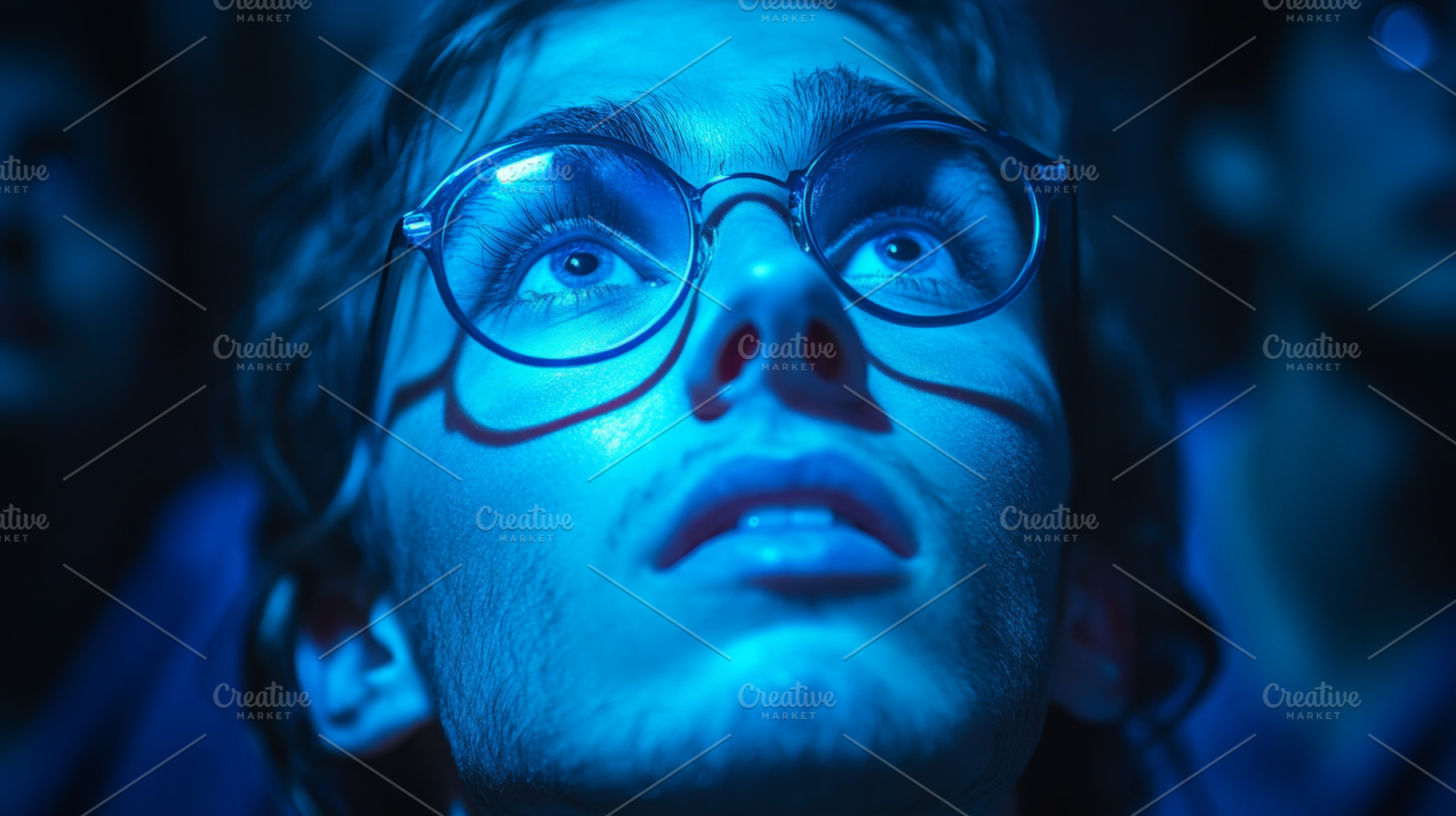 Young Man in Awe Under Dramatic Blue Lighting, an Abstract Photo by Natalia Klenova's Shop