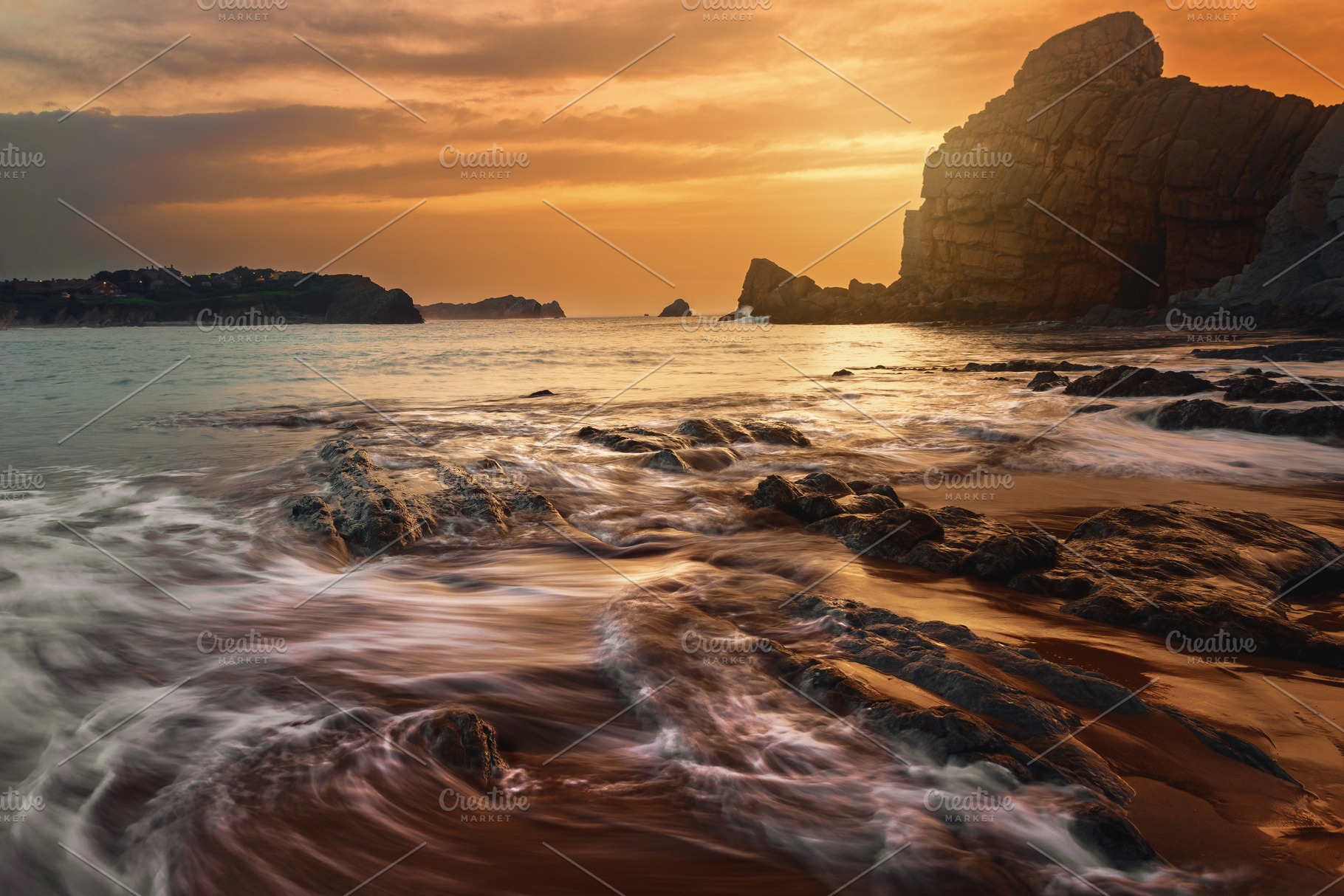 Golden sunset on a rocky coast with, a Nature Photo by Perpis