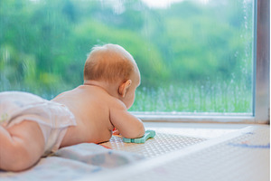 Little baby looking through a window, a Person Photo by Elizaveta Galitskaya