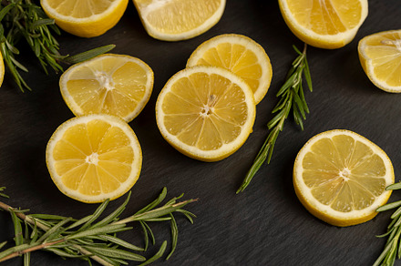 slices of sour lemon on a black board, a Photo by MyPhotos